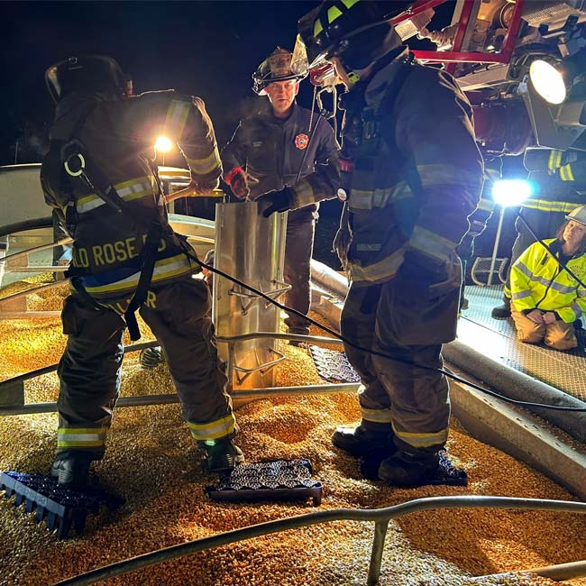 Wild Rose Area Fire District department firefighters train on corn trapped man exercise